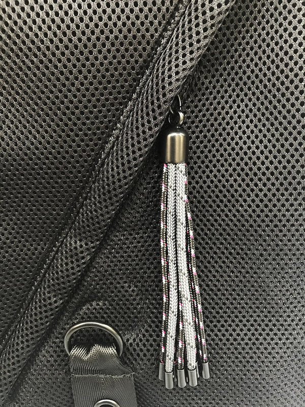 Fun tassel detail to bring style to this knapsack and is a great functional detail to make for a easy zip pull on the front pocket. 