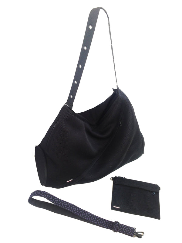 The Weekender includes a snap-in, snap-out pouch for use as a crossbody or clutch